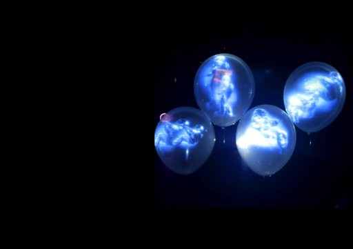 Suspended holographic light forms in a dark space